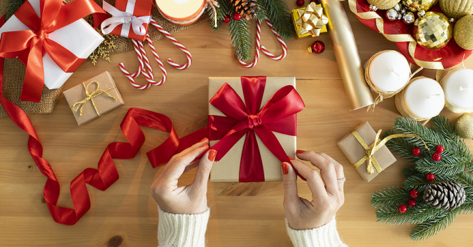 Lady wrapping a gift